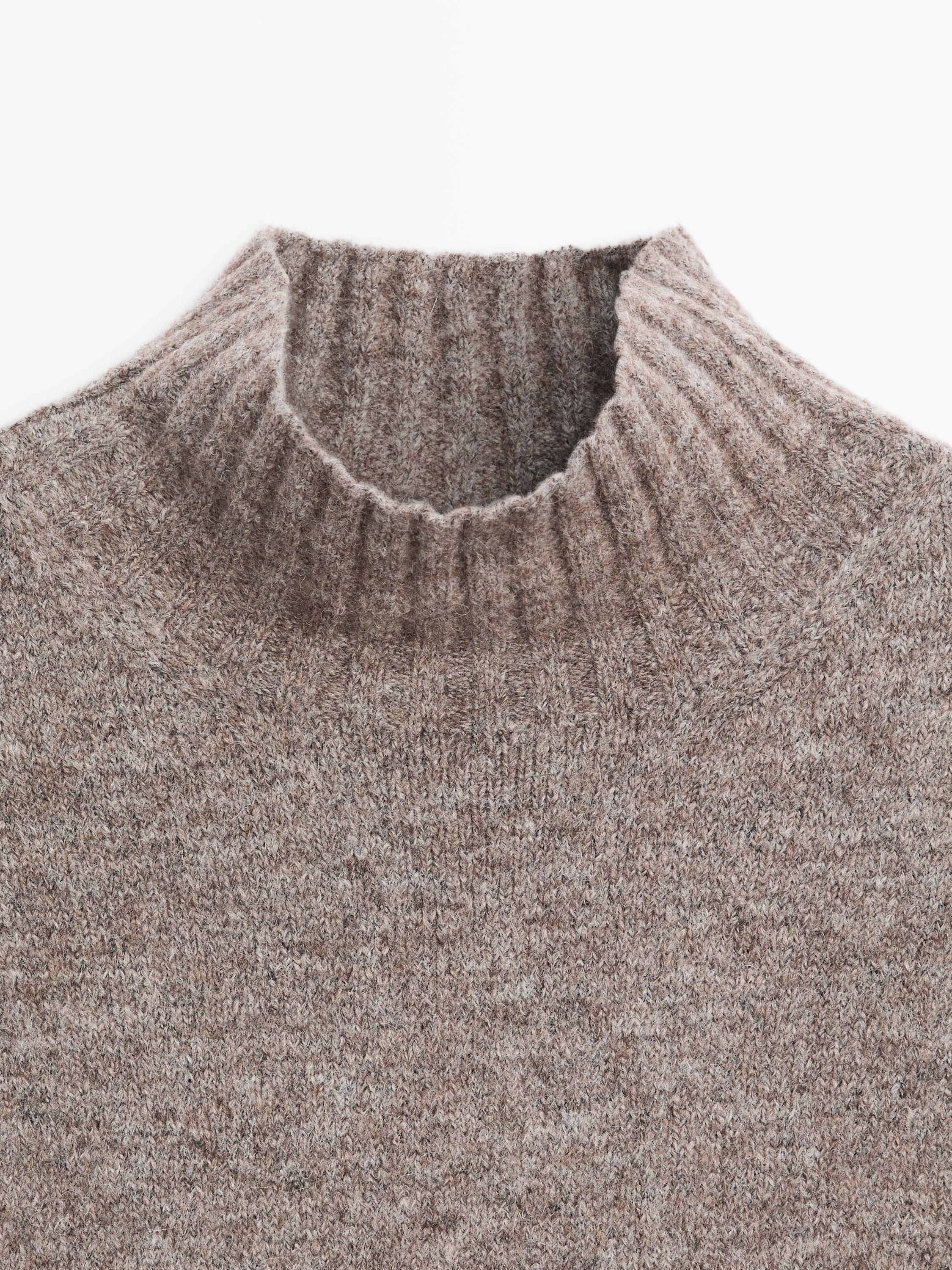 Sleeveless high neck sweater